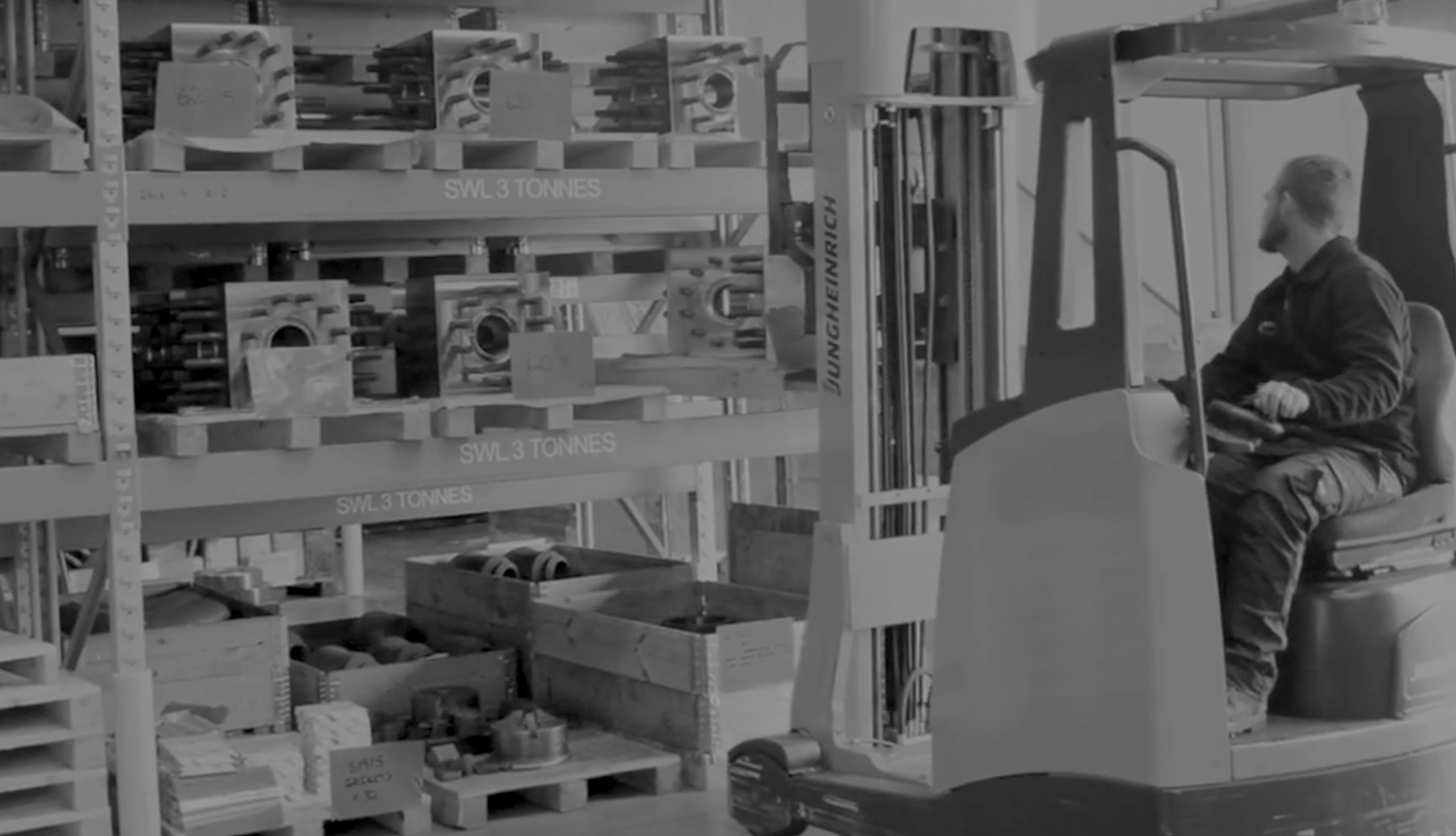 A forklift collects an API flange from large shelves within a Marcore manufacturing facility